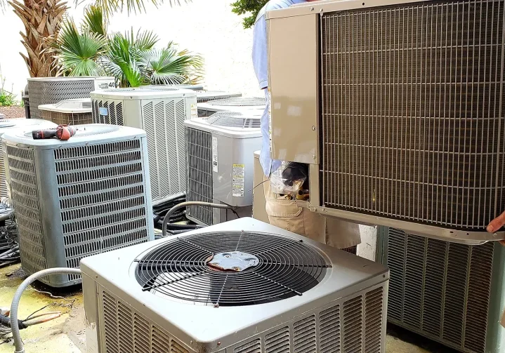 hvac-technician-removing-old-rusted-broken-aircond-2023-11-27-05-03-37-utc
